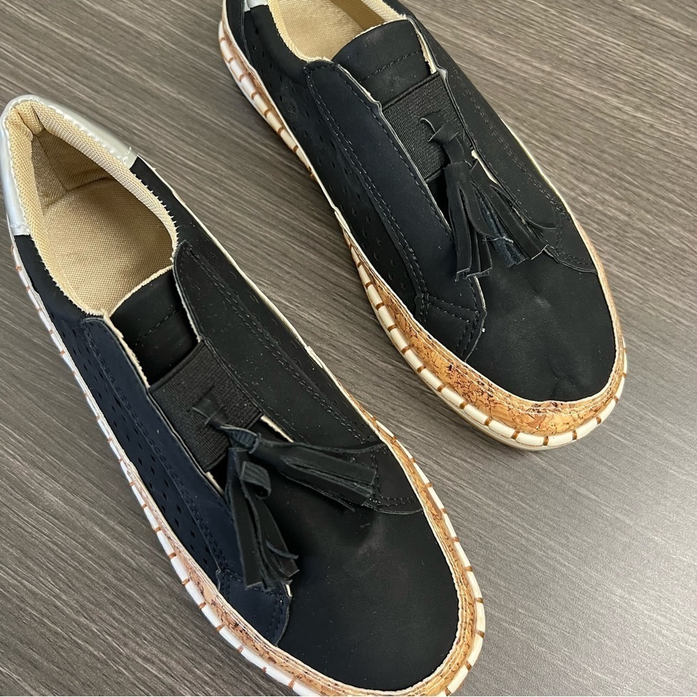 Never Worn size 37 (size 6) Black Slip On Shoe with Cork Detail and Tass…